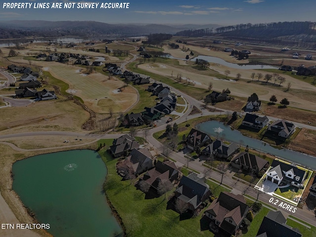 aerial view with a residential view and a water view