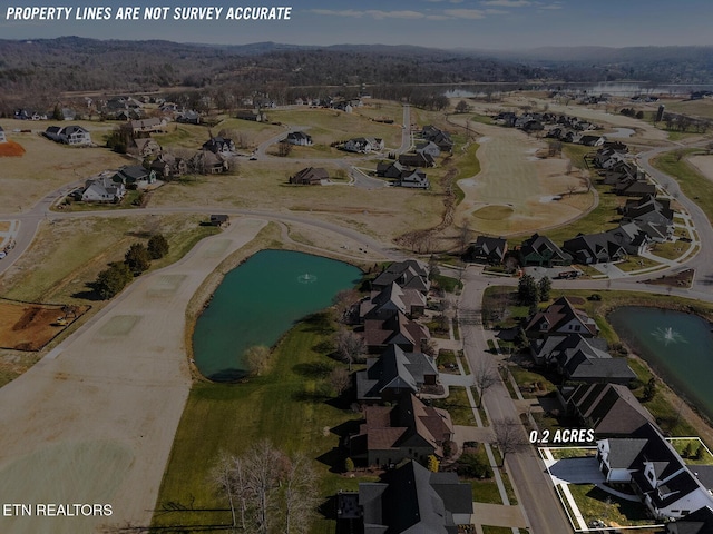 birds eye view of property featuring a residential view and a water view