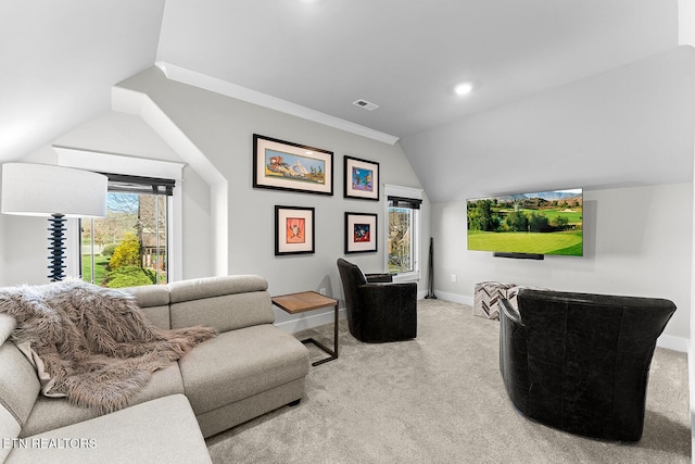 living room featuring lofted ceiling, carpet, baseboards, and visible vents