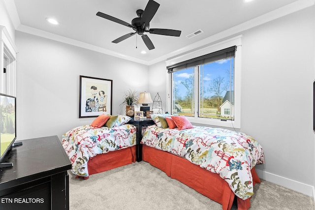 carpeted bedroom with recessed lighting, visible vents, baseboards, and crown molding