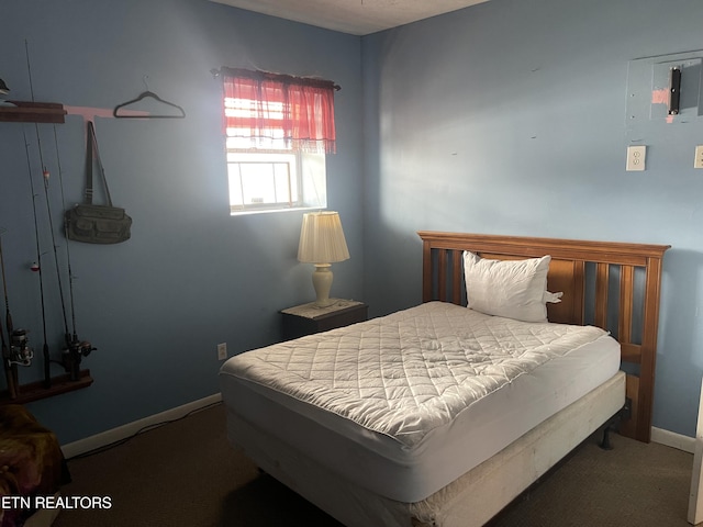 carpeted bedroom with baseboards