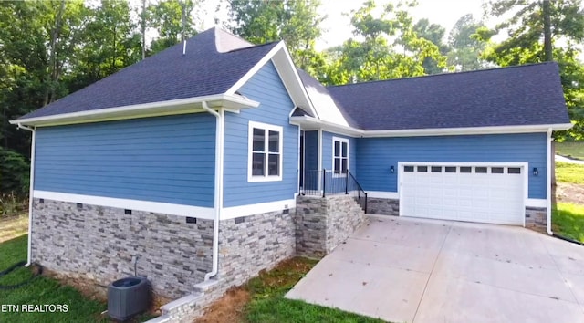 553 Hickory Pointe Ln, Maynardville, TN 37807 - single story home featuring an attached garage, stone siding, concrete driveway, and a shingled roof