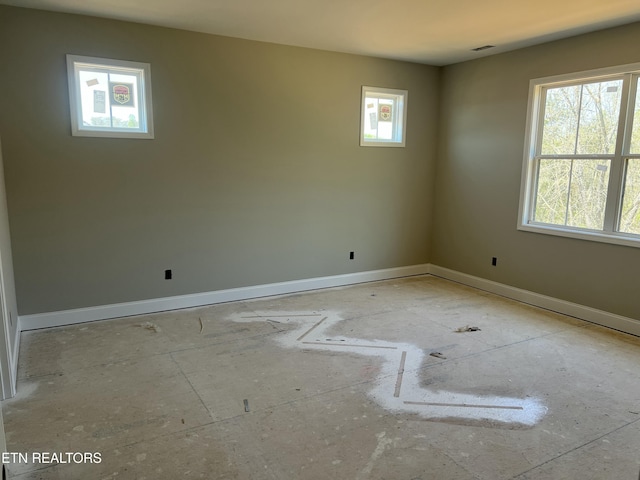 empty room with visible vents and baseboards