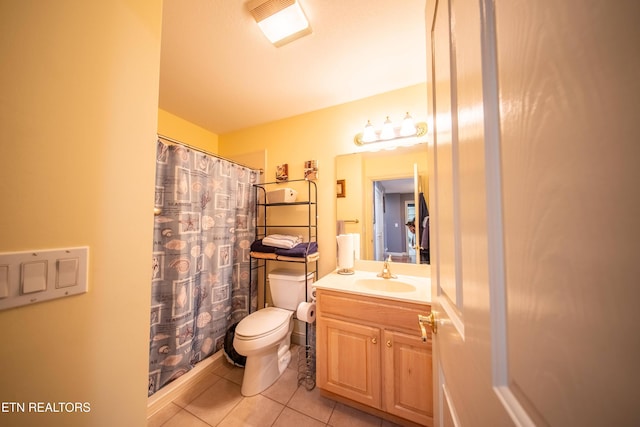bathroom featuring tile patterned floors, a shower with shower curtain, toilet, and vanity