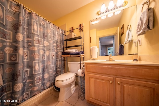 full bathroom featuring tile patterned floors, toilet, and vanity