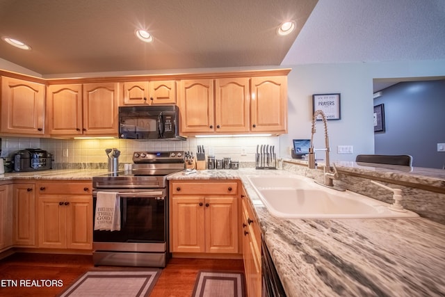 kitchen with stainless steel range with electric stovetop, backsplash, recessed lighting, and black microwave