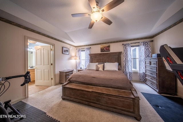 bedroom featuring light carpet, ceiling fan, a raised ceiling, and lofted ceiling