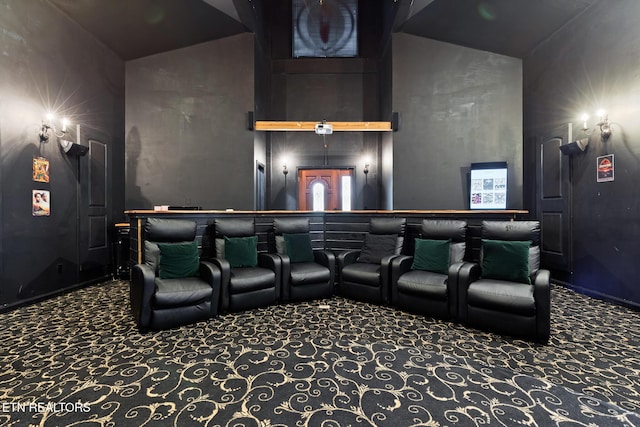 carpeted cinema with a high ceiling