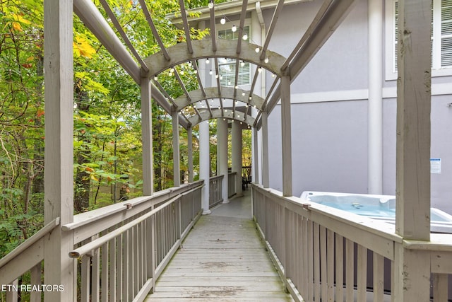 exterior space with a hot tub