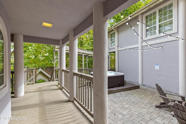 view of patio / terrace with a hot tub