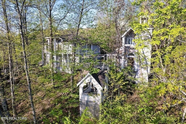 exterior space with a view of trees