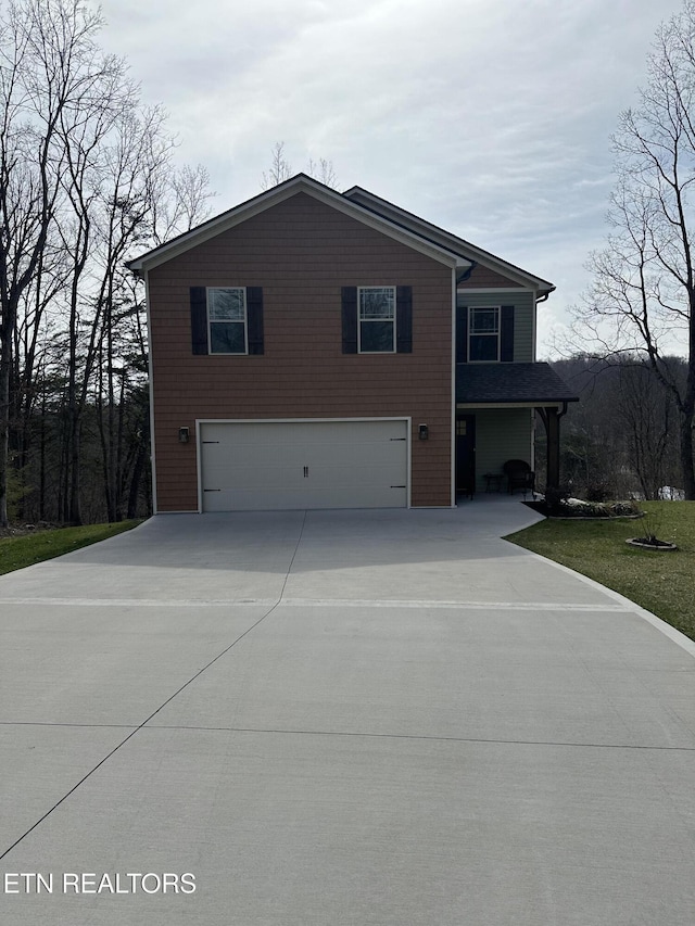 view of front of property with an attached garage and driveway