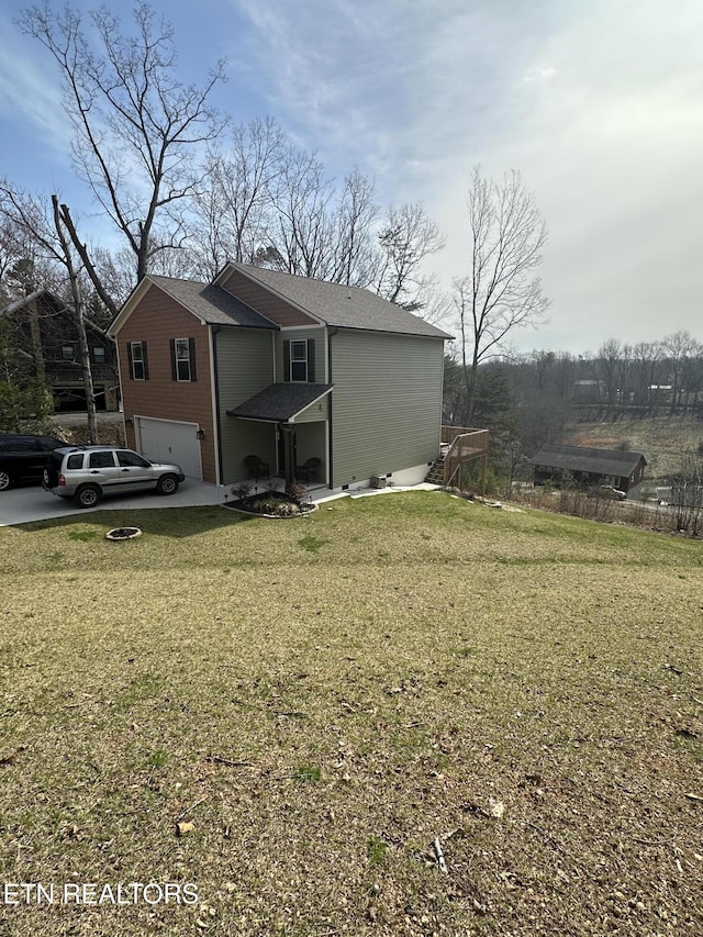 exterior space with a front lawn, a garage, and a shingled roof