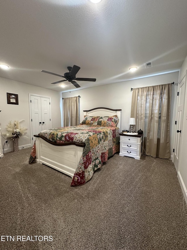 bedroom with carpet flooring, a ceiling fan, visible vents, and baseboards