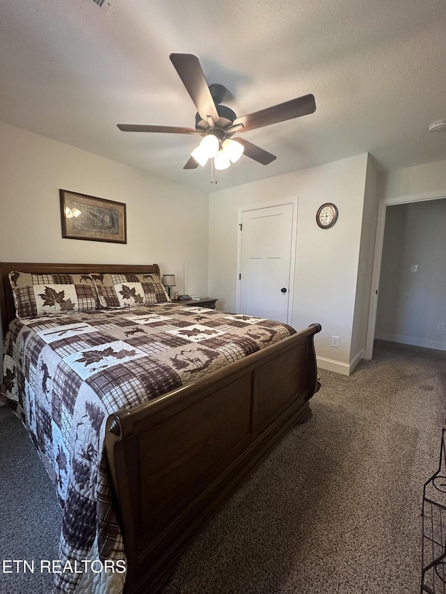 bedroom with a ceiling fan, baseboards, carpet floors, and a textured ceiling