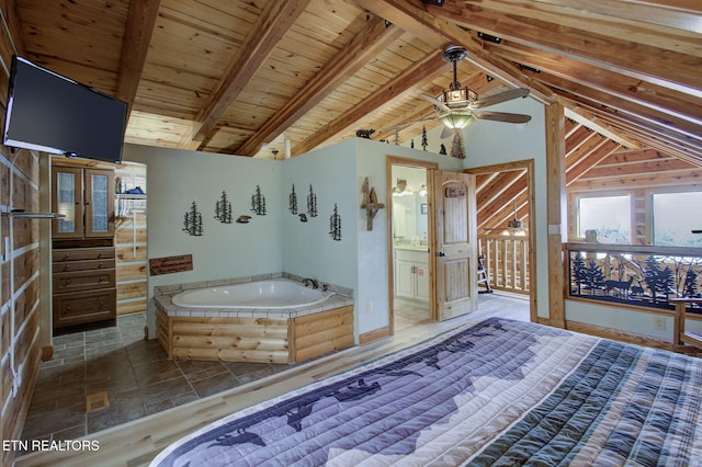 940 Stans Rd, Gatlinburg, TN 37738 - unfurnished bedroom with ensuite bath, stone finish floor, wooden ceiling, and vaulted ceiling with beams