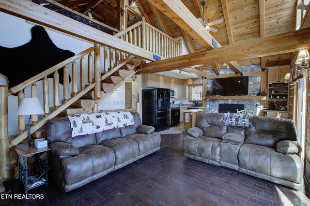 940 Stans Rd, Gatlinburg, TN 37738 - living area featuring wood ceiling, stairs, beam ceiling, a fireplace, and dark wood-style flooring