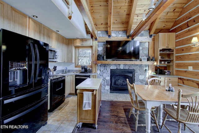 940 Stans Rd, Gatlinburg, TN 37738 - kitchen featuring a fireplace, light brown cabinetry, black appliances, light countertops, and wood ceiling