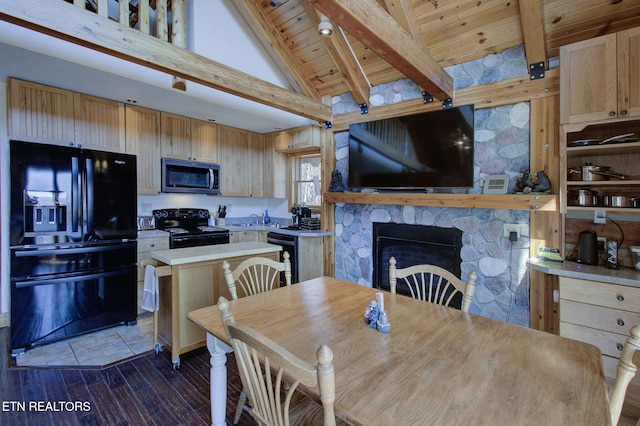 940 Stans Rd, Gatlinburg, TN 37738 - dining space featuring beamed ceiling, high vaulted ceiling, dark wood-style floors, a stone fireplace, and wooden ceiling