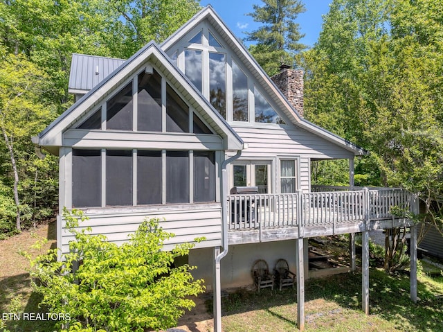 413 Settlers Rise Rd, Townsend, TN 37882 - rear view of property with a sunroom, a wooden deck, and a chimney