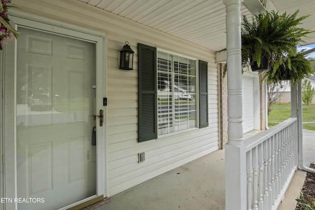 doorway to property featuring a porch
