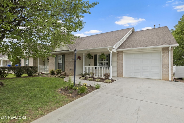 ranch-style house with covered porch, a garage, driveway, and brick siding