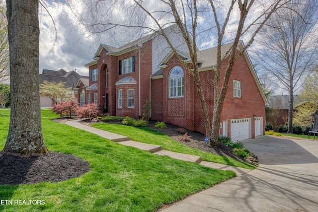 231 Gwinhurst Rd, Knoxville, TN 37934 - view of front facade featuring driveway, a garage, a front yard, and brick siding