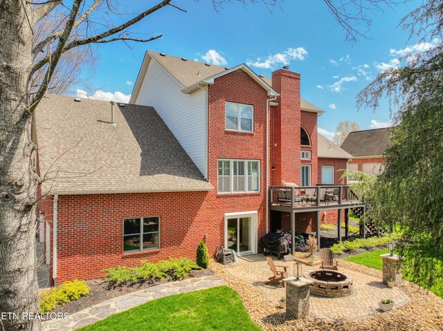 231 Gwinhurst Rd, Knoxville, TN 37934 - back of property featuring a patio area, brick siding, a deck, and a chimney