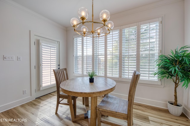 231 Gwinhurst Rd, Knoxville, TN 37934 - dining area featuring a chandelier, a wealth of natural light, light wood-style flooring, and ornamental molding