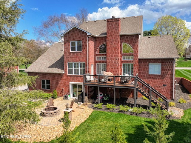 231 Gwinhurst Rd, Knoxville, TN 37934 - rear view of property featuring a chimney, stairway, an outdoor fire pit, a deck, and a lawn