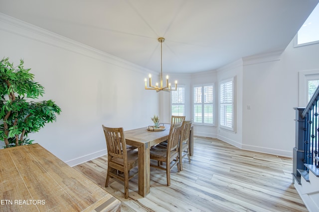 231 Gwinhurst Rd, Knoxville, TN 37934 - dining room with crown molding, light wood-type flooring, and an inviting chandelier