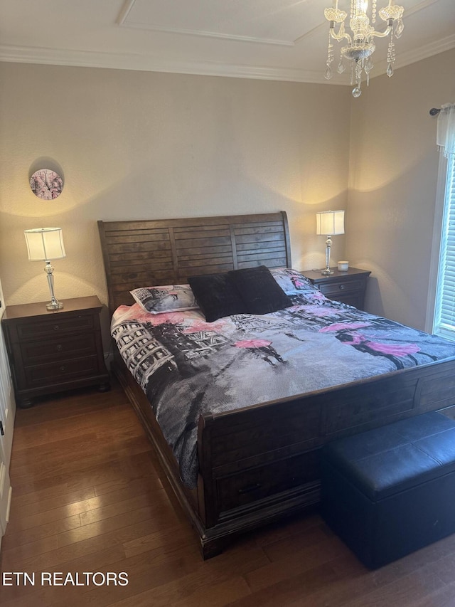 bedroom featuring crown molding, a chandelier, and hardwood / wood-style flooring