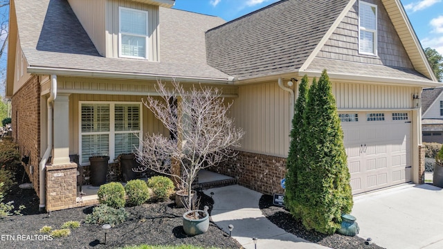 1022 Providence Grove Way, Knoxville, TN 37919 - view of front of house with brick siding, a shingled roof, a garage, and concrete driveway
