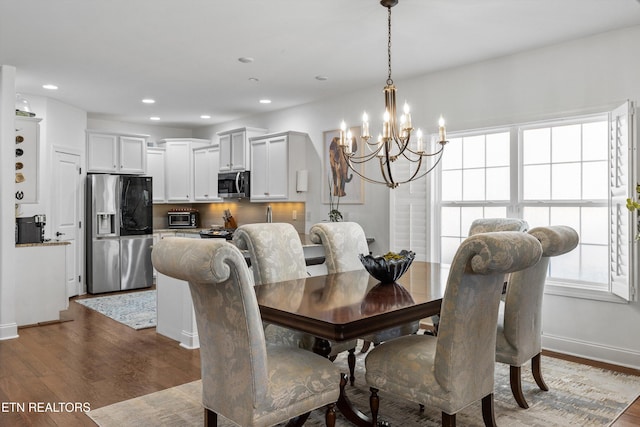 1022 Providence Grove Way, Knoxville, TN 37919 - dining area with baseboards, an inviting chandelier, dark wood-style floors, recessed lighting, and a toaster