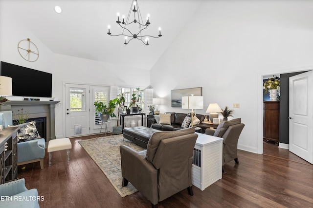1022 Providence Grove Way, Knoxville, TN 37919 - living area with high vaulted ceiling, a glass covered fireplace, a chandelier, wood finished floors, and baseboards