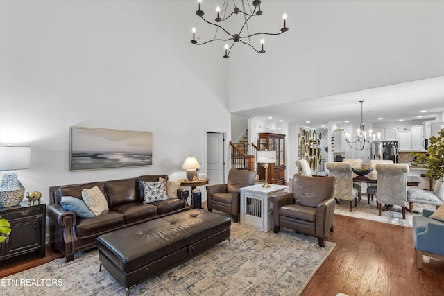 1022 Providence Grove Way, Knoxville, TN 37919 - living room with a towering ceiling, a chandelier, wood finished floors, and stairs