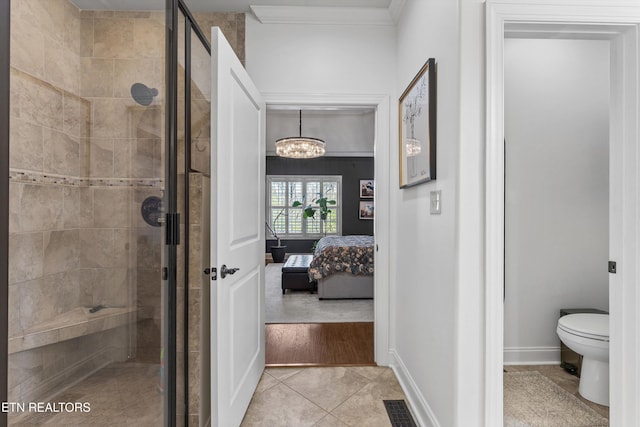 1022 Providence Grove Way, Knoxville, TN 37919 - ensuite bathroom with a stall shower, a chandelier, tile patterned flooring, ensuite bathroom, and toilet