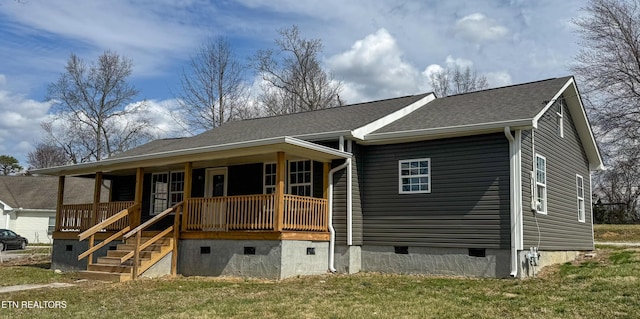 view of front of property with a front yard, stairway, a porch, a shingled roof, and crawl space