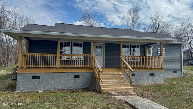 view of front of property with a shingled roof, covered porch, and crawl space