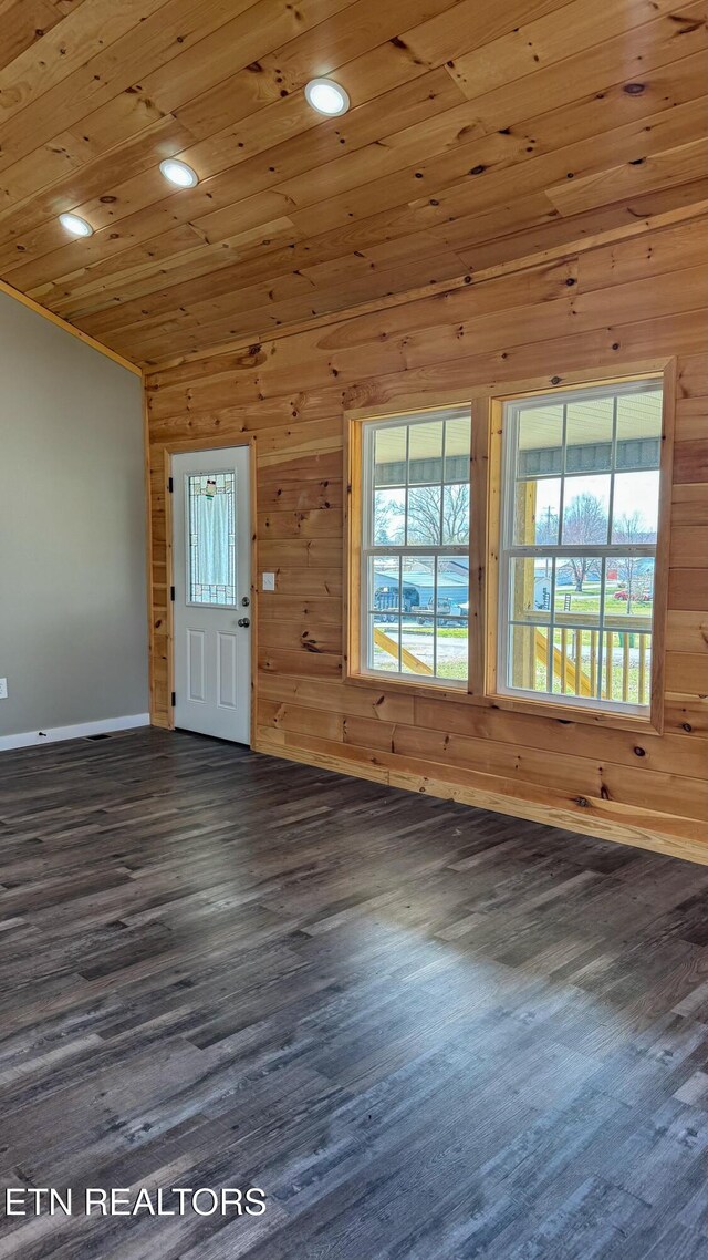 empty room with recessed lighting, wood ceiling, wood walls, and dark wood-style flooring