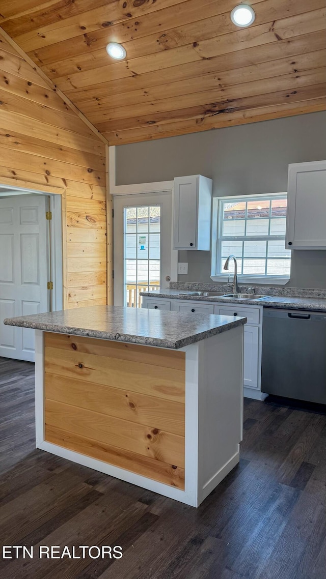 kitchen with a kitchen island, lofted ceiling, a sink, dishwasher, and wooden ceiling