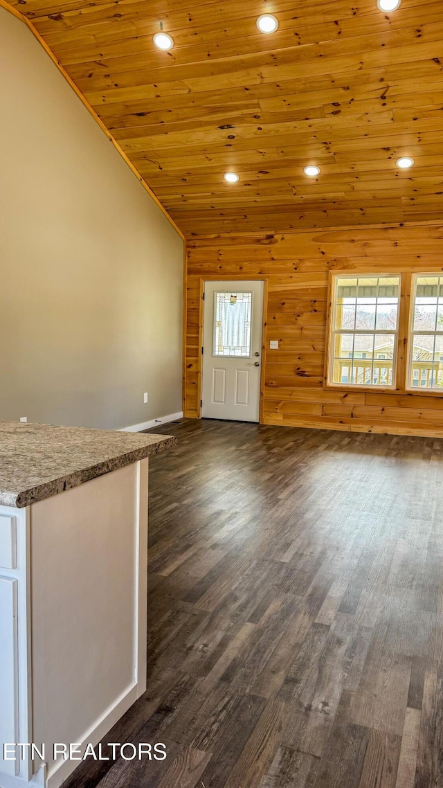 unfurnished living room with recessed lighting, high vaulted ceiling, wooden ceiling, and dark wood-style flooring