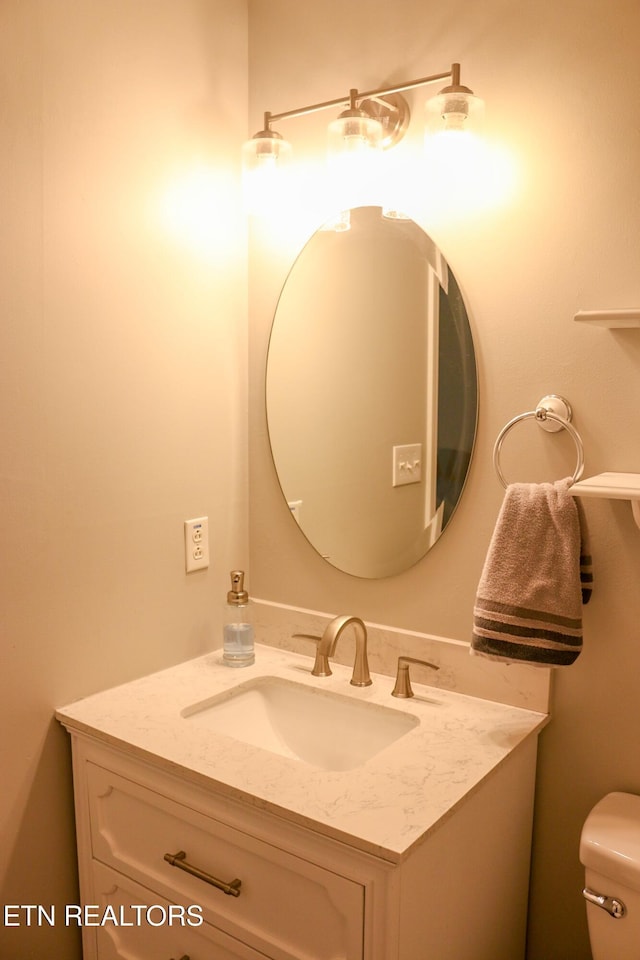 half bath with vanity and toilet