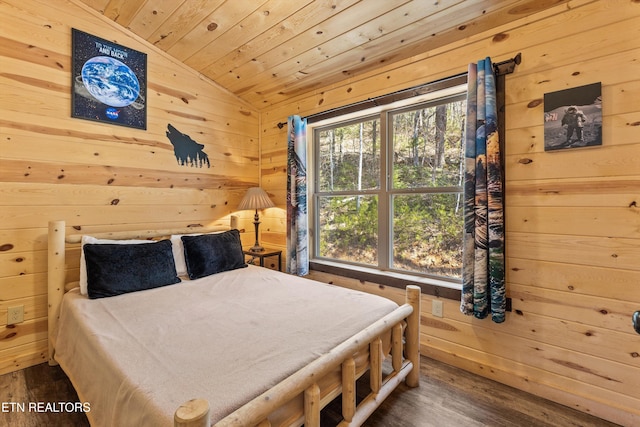 bedroom featuring lofted ceiling, wood walls, wood ceiling, and wood finished floors
