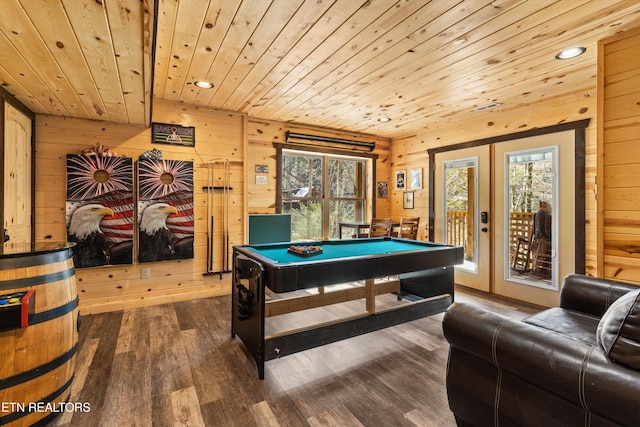 game room featuring dark wood finished floors, wooden ceiling, wood walls, and pool table