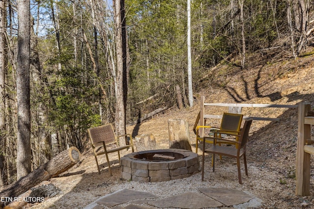 view of patio / terrace featuring an outdoor fire pit