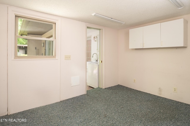 123 Manor Rd, Clinton, TN 37716 - unfurnished room with carpet floors, washer / dryer, and a textured ceiling