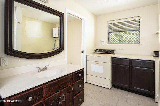 123 Manor Rd, Clinton, TN 37716 - bathroom with washer / dryer, tile patterned floors, and vanity
