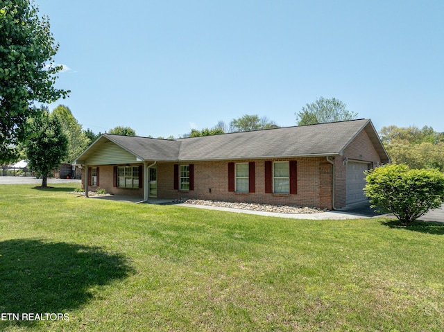 ranch-style home featuring driveway, a front lawn, brick siding, and a garage