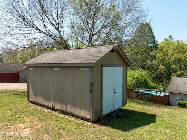 view of shed with fence